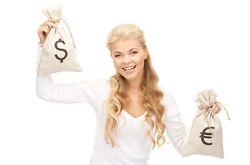 Image showing woman with euro and dollar bags