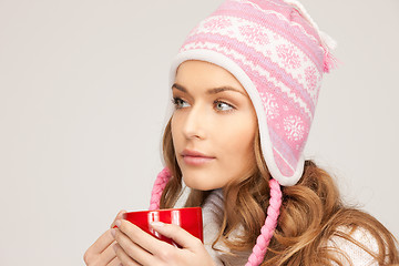 Image showing beautiful woman with red mug