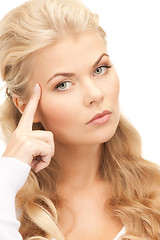 Image showing pensive businesswoman over white