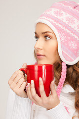 Image showing beautiful woman with red mug