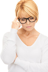 Image showing pensive businesswoman over white