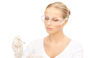 Image showing attractive female doctor with thermometer