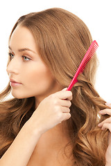 Image showing beautiful woman with comb