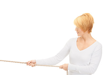 Image showing business woman pulling rope