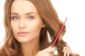 Image showing beautiful woman with comb