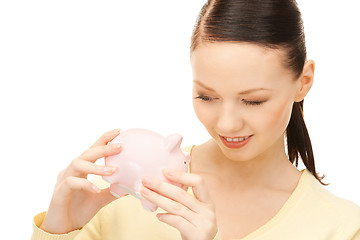 Image showing  lovely woman with piggy bank	 