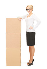 Image showing  attractive businesswoman with big boxes	 