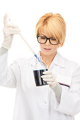 Image showing lab worker holding up test tube