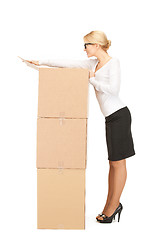Image showing  attractive businesswoman with big boxes	 