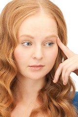 Image showing pensive businesswoman over white