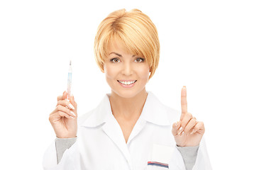 Image showing attractive female doctor with thermometer