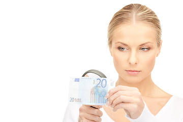 Image showing woman with magnifying glass and money