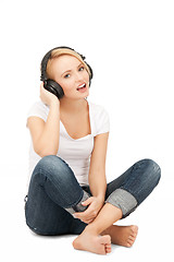 Image showing  happy teenage girl in big headphones