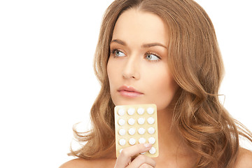 Image showing young beautiful woman with pills 