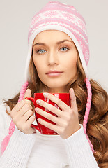 Image showing beautiful woman with red mug