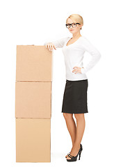 Image showing  attractive businesswoman with big boxes	 