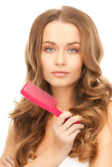 Image showing beautiful woman with comb