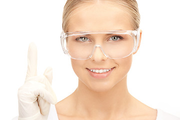 Image showing woman in protective glasses and gloves