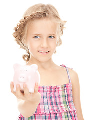 Image showing little girl with piggy bank