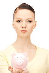 Image showing  lovely woman with piggy bank	 