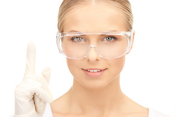 Image showing woman in protective glasses and gloves