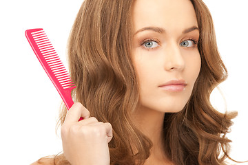 Image showing beautiful woman with comb