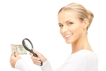 Image showing woman with magnifying glass and money