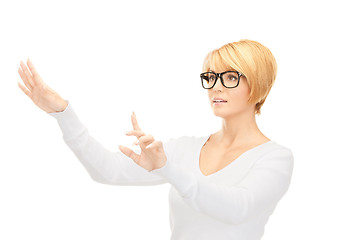 Image showing businesswoman working with something imaginary 