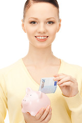 Image showing lovely woman with piggy bank 