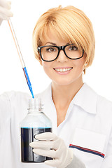 Image showing lab worker holding up test tube