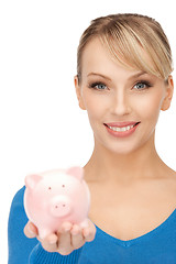 Image showing lovely woman with piggy bank