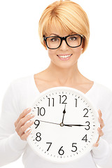 Image showing woman holding big clock