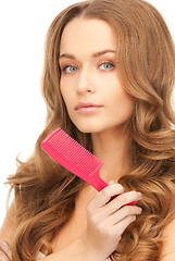 Image showing beautiful woman with comb