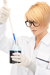 Image showing lab worker holding up test tube