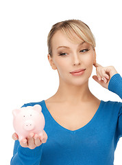 Image showing lovely woman with piggy bank