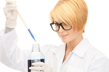 Image showing lab worker holding up test tube