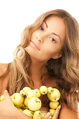 Image showing lovely woman with green apples