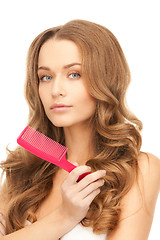 Image showing beautiful woman with comb