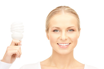 Image showing woman holding energy saving bulb