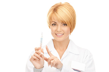 Image showing attractive female doctor with thermometer