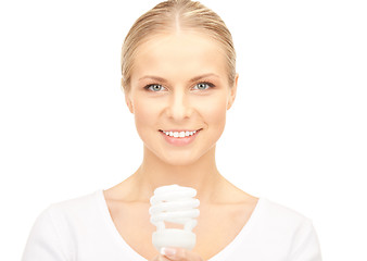 Image showing woman holding energy saving bulb