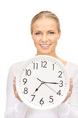 Image showing woman holding big clock