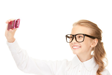 Image showing happy girl taking picture with cell phone