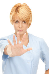 Image showing attractive female doctor showing stop gesture