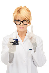 Image showing lab worker holding up test tube