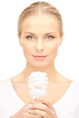 Image showing woman holding energy saving bulb