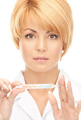 Image showing attractive female doctor with thermometer