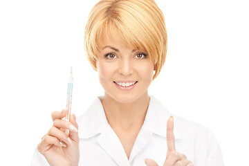 Image showing attractive female doctor with thermometer