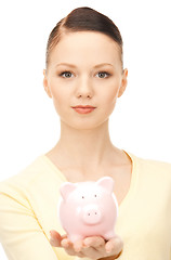 Image showing  lovely woman with piggy bank	 