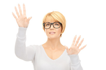 Image showing businesswoman working with something imaginary 